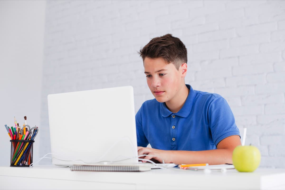 A senior student studying at his desk