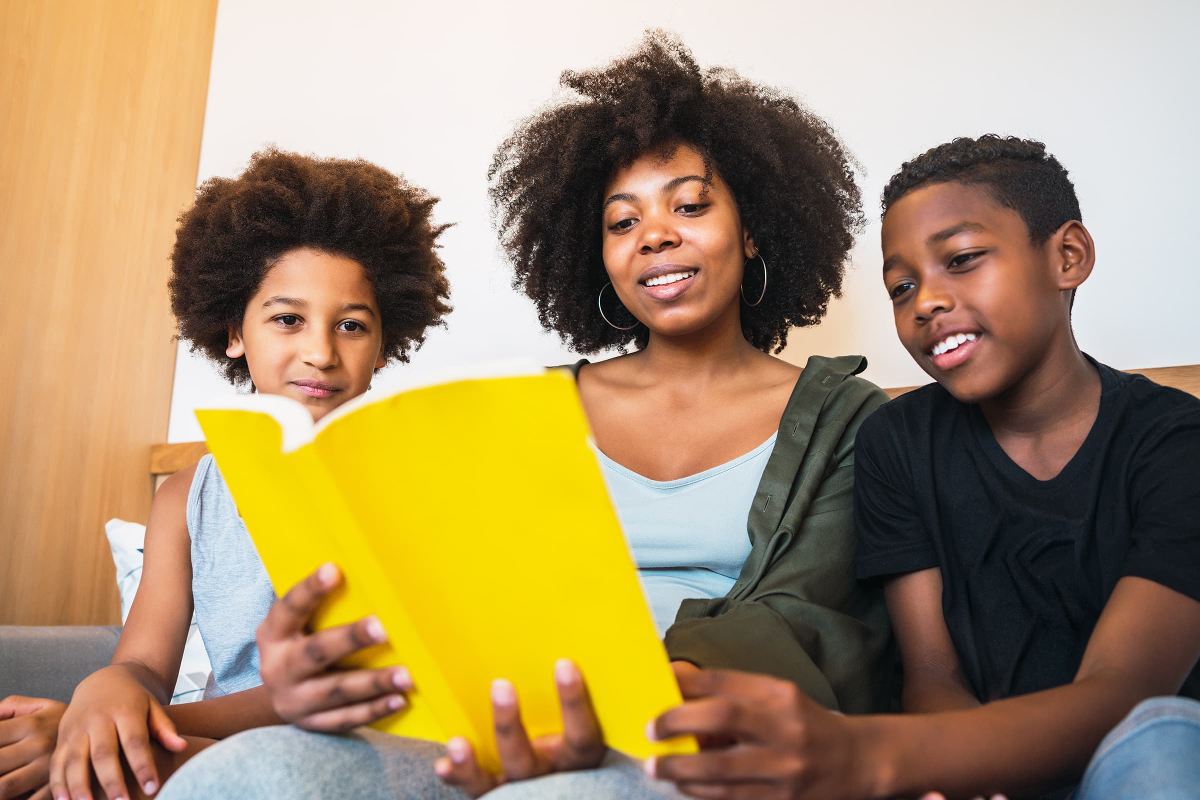 A parent and children learning together